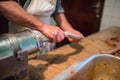 Man making sausages the traditional way using sausage filler. Royalty Free Stock Photo