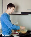 Man making scrambled eggs Royalty Free Stock Photo