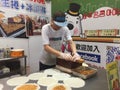 A man making traditional cake in Jiufen, Taiwan