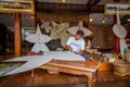 The man is making the traditional kite