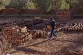 Man making traditonal mud bricks at Ait Ben Haddou ksar Morocco, ancient UNESCO