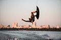 man making trick in jump time with wakeboard on sky background. Royalty Free Stock Photo