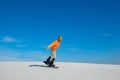 Man making a trick on snowboard on sand slope Royalty Free Stock Photo