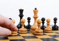 Man making the white pawn move in a chess game Royalty Free Stock Photo