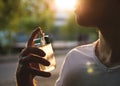 Man with male perfume over nature background