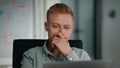 Man manager planning project sitting workspace closeup. Young man looking laptop Royalty Free Stock Photo