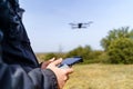 Man managing control over a drone flying in front of him Royalty Free Stock Photo