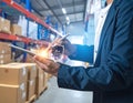 Man managing warehouse data using digital tablet with interface Royalty Free Stock Photo