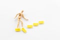 Man mannequin figure falling down from stairs. Accident failure and fiasco in business concept Royalty Free Stock Photo