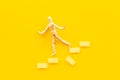 Man mannequin figure falling down from stairs. Accident failure and fiasco in business concept Royalty Free Stock Photo