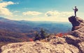 Man with map overlooking mountains belown Royalty Free Stock Photo