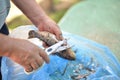 a man cleans fish with scissors