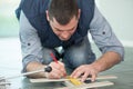 man marking tile to be cut Royalty Free Stock Photo