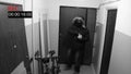 The man in the mask breaks the door in and shoots hidden camera pistol