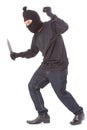 Man in a mask holding flashlight with a knife Royalty Free Stock Photo