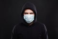 Man in Mask and Hood. Boy in Medicine Mask and Hoodie Royalty Free Stock Photo