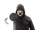 Man in mask and hoodie pokes in face with baseball bat, isolated