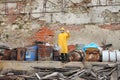 Man with mask and protective clothes explores danger area Royalty Free Stock Photo