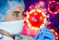 Man in a mask and protective gloves on the background of the image of a coronavirus. Doctor with a vaccine and a syringe