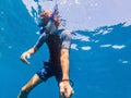 Man with mask snorkeling in clear water Royalty Free Stock Photo