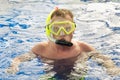 Man with mask snorkeling in clear water. pool Royalty Free Stock Photo