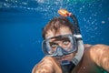 Man with mask snorkeling in clear water Royalty Free Stock Photo