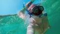 Man with mask snorkeling in clear water. Thailand Royalty Free Stock Photo