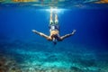 Man With Mask Swimming Underwater In Tropical Sea