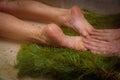 A man massaging a woman& x27;s legs in a hammam Royalty Free Stock Photo