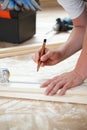 Man measuring boards during renovation