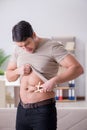 The man measuring body fat with calipers Royalty Free Stock Photo