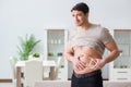 The man measuring body fat with calipers Royalty Free Stock Photo