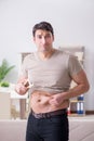 The man measuring body fat with calipers Royalty Free Stock Photo