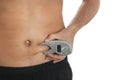 Man measuring body fat layer with digital caliper on background, closeup. Nutritionist`s tool