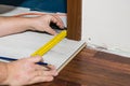 Man measuring floor panels Royalty Free Stock Photo