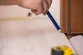 Man measuring floor panels