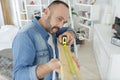 Man measuring length wood in living room Royalty Free Stock Photo