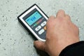 Man measuring moisture of the floor Royalty Free Stock Photo