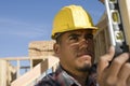 Man Measuring Vertical Level Of Wood Royalty Free Stock Photo