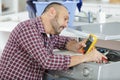 Man measuring voltage washing machine Royalty Free Stock Photo