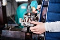 Man mechanic repairing a car in a garage. Royalty Free Stock Photo