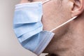 Man with a medical face mask. Covid-19, coronavirus. Wear a mask, stay safe. Royalty Free Stock Photo