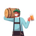 Man in medical mask holding beer barrel and mug Oktoberfest party celebration coronavirus quarantine Royalty Free Stock Photo