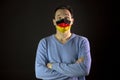 Man in medical mask. Isolated. Coronavirus outbreak in Germany. Global pandemic Royalty Free Stock Photo