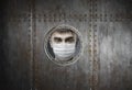 Man in medical mask locked in insulator