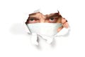 Man in medical mask peeping through hole on paper. Male Eye looking through hole. Isolated on white background. covid - Royalty Free Stock Photo