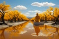 Man meditates in the autumn forest. Clear lake. Autumn landscape. Royalty Free Stock Photo