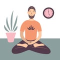 A man meditates at home. Sits in the lotus position and concentrates.