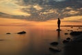 Man meditates on lake water Royalty Free Stock Photo