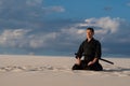 Man meditating before martial arts training Royalty Free Stock Photo